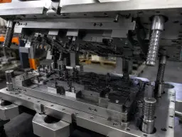 Graphite lubricant on a metal stamping die